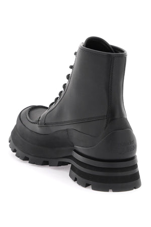 ALEXANDER MCQUEEN Men's Black Leather Ankle Boots with Oversized Sole and Iconic Logo Print