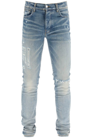 AMIRI Light Blue Distressed Skinny Jeans for Men - SS23 Collection