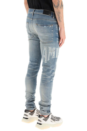 AMIRI Light Blue Distressed Skinny Jeans for Men - SS23 Collection