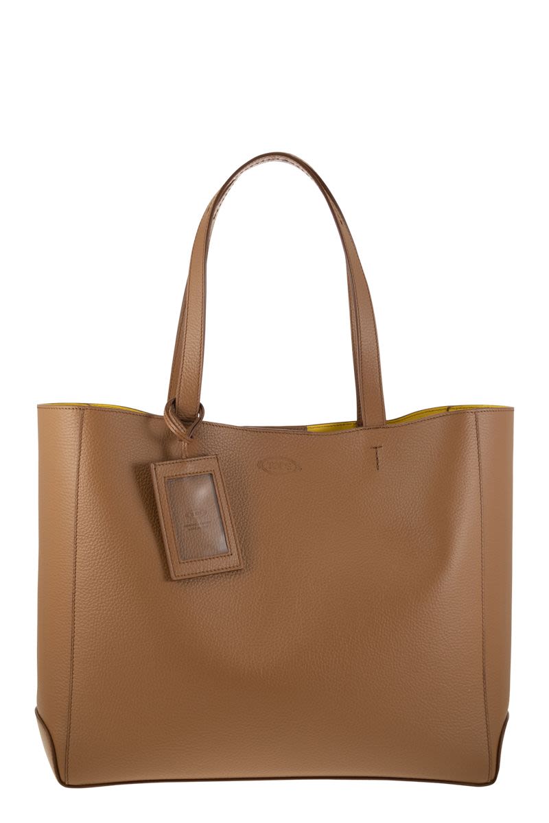 经典棕色真皮手提包 - 流畅线条与优雅造型